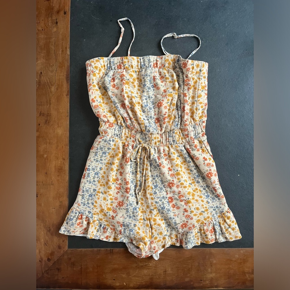 Red, yellow, and blue floral romper